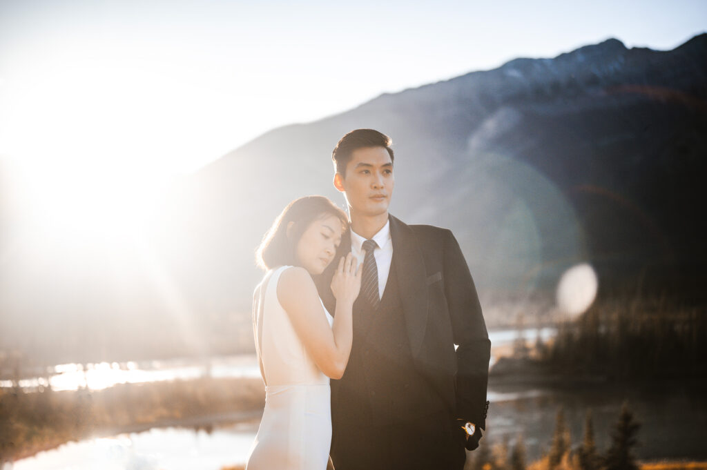 Bride and Groom walking on the Overlander Trail during sunset in Jasper